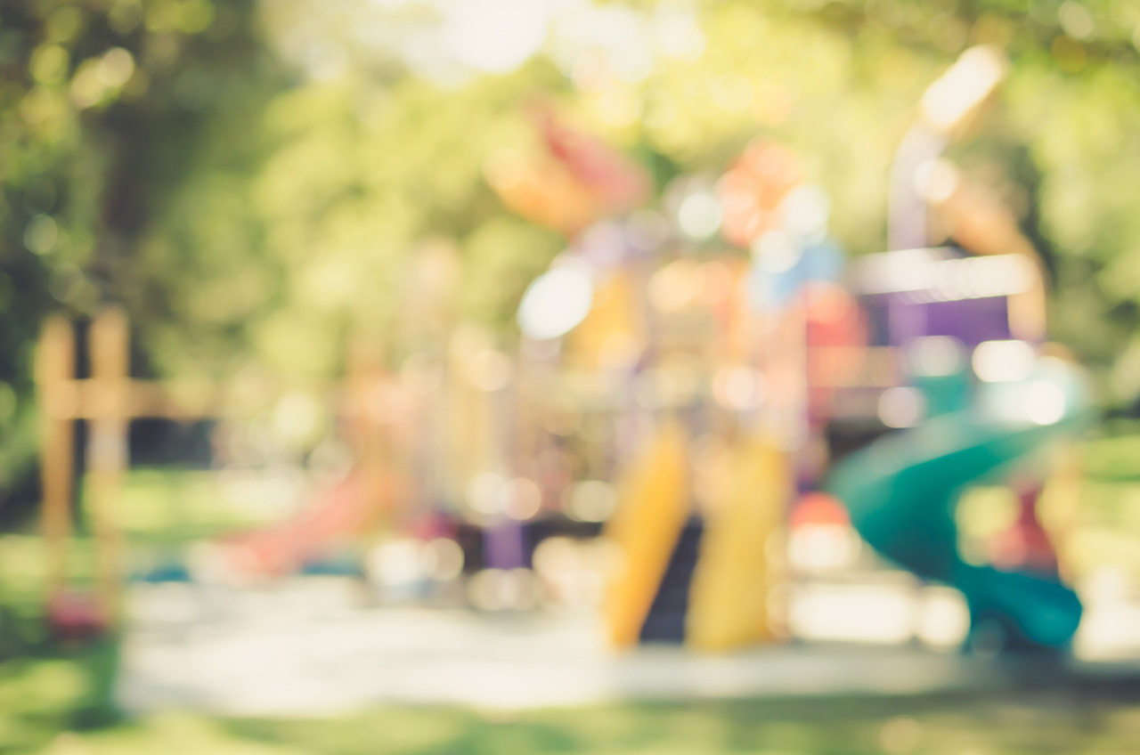 Blur playground in park abstract background. Film tone effect.